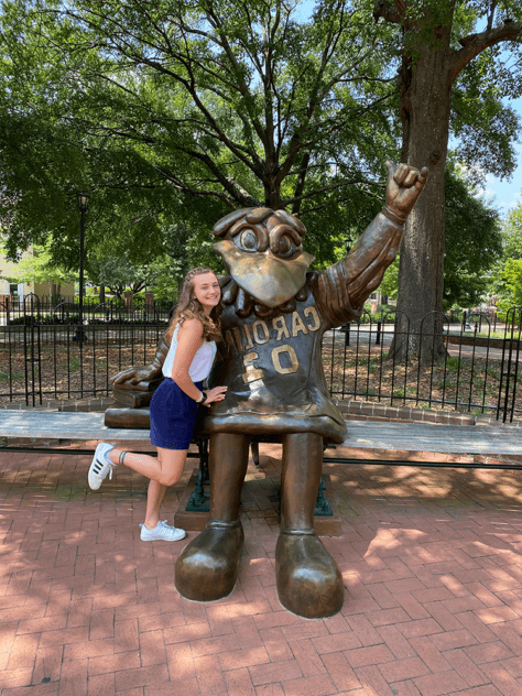 W&J alumna, Ashely Kunkle poses with University of South Carolina mascot statue.